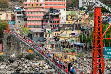 Rishikesh, India - Circa April 2018. Beautiful view of Ganga river embankment in Rishikesh. People...