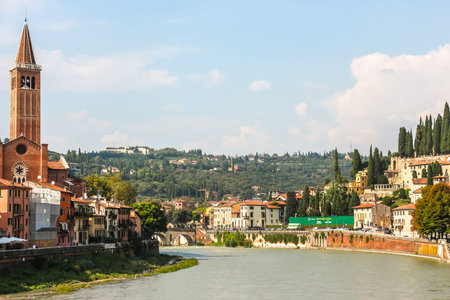 Verona, Italy - Circa September 2018. View of Adige river embankment in sunny day.