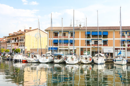 Grado, Italy - Circa August 2018. Beautiful view of moored yachts and sailboats in Grado.のeditorial素材
