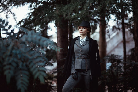 Portrait of a girl in the Park. Fashion, English style.