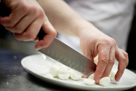 man cutting vegetablesの写真素材