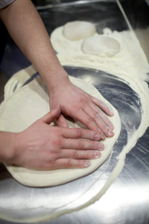 man hands knead dough