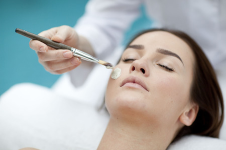 Young woman getting a massage in a spaの写真素材