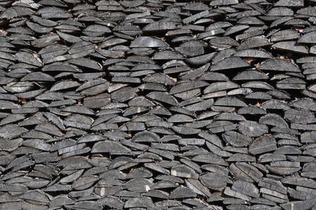 Firewood in a woodpile, vintage texture. Chipped firewood as a backgroundの写真素材