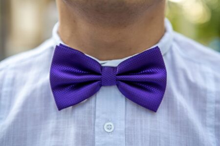 A close-up bow tie with a white shirt. The groom's wedding suit. Luxury decoration design. Vintage style. Modern design.の写真素材