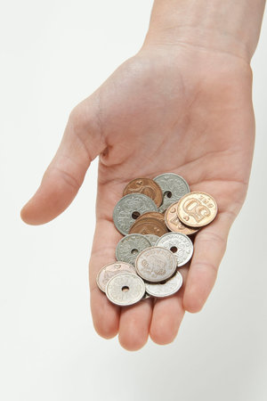 Closeup of a hand holding Danish currency
