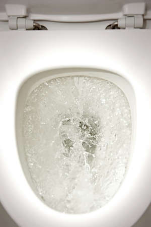 Closeup of water flushing in a toiletの写真素材