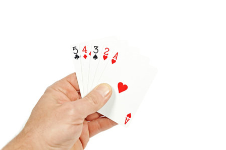 The hand of a Poker player holding straight