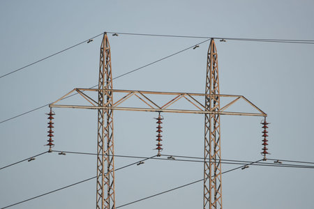 Overhead power lines with blue skies in the background