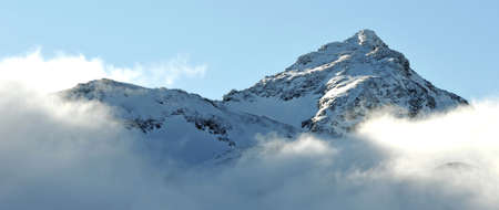 Mountains of Val Thorens, France with blue skies in the backgroundの写真素材