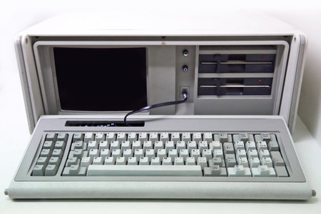 Old white personal computer with floppy disk drives