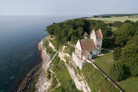 Aerial view of Stevns cliff and Hoejerup Old Church located in Zealand, Denmarkの写真素材