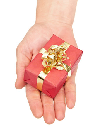 Hand holding a small colourful christmas present