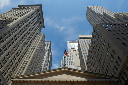 Manhattan skyscrapers in New York city with blue skies in the background
