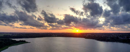 Aerial view of Soendersoe lake at sunset in Zealand in Denmarkの写真素材