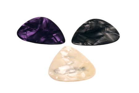 Three guitar picks on white 
