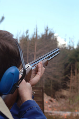 Man shooting clay pigeons