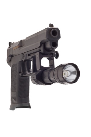 Looking down the barrel of a large 9mm automatic pistol with flashlightの写真素材