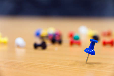 blue push pin on the tableの写真素材