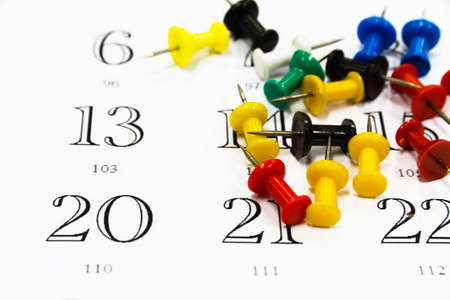 Push pins  on a calendarの写真素材