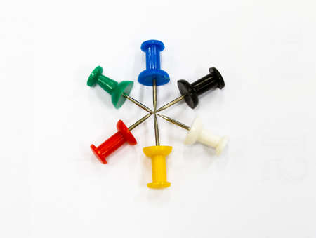 Push pins arranged in a star shape on whiteの写真素材