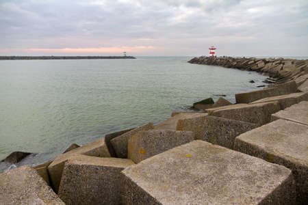 Concrete blocks form the jetty of the harbor of Scheveningen in the Netherlandsのeditorial素材