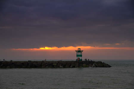 Sunset behind the jetty in Scheveningen, the Netherlandsのeditorial素材