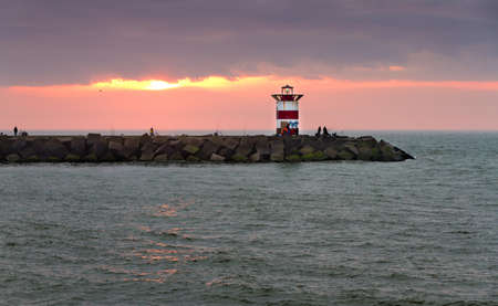 Sunset behind the jetty in Scheveningen, the Netherlandsのeditorial素材
