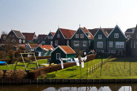 Laundry drying in the backyard in the traditional town of Marken in the Netherlandsの写真素材