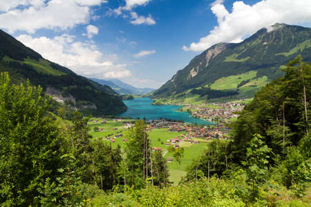 Beautiful scenic view on the town of Lungern and the Lungerersee in Switzerlandの写真素材