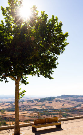 Beautiful landscape view point with a bench in Tuscany, Italyの写真素材
