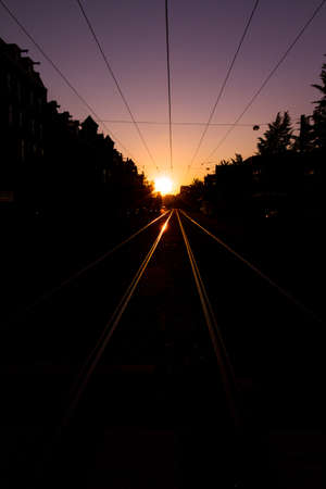 Reflecting rails in the streets of Amsterdam early in the morningの写真素材