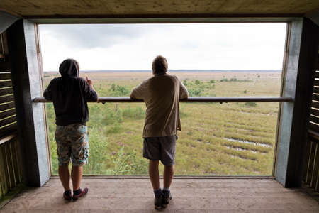 Two men looking out over the Fochteloerveen heathland in the Netherlandsのeditorial素材