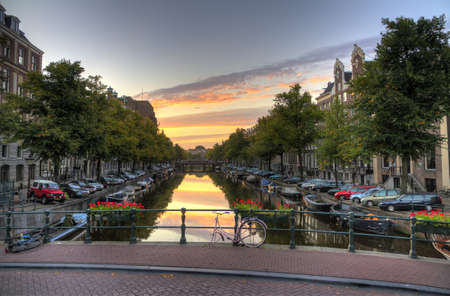 Early morning view from a bridge down a canal in Amsterdam, the Netherlands  HDRの写真素材