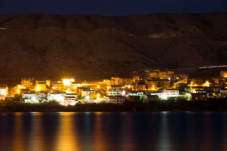Evening view on the town of Pag in Croatia, on the other side of the bayの写真素材