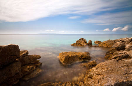 Long exposure image of the rocky coastline of Croatiaの写真素材