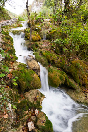 A beautiful cascade next to the path in Plitvice national park, in Croatiaの写真素材