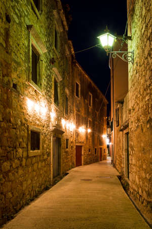 Mediterranean alley in a small town at nightの写真素材