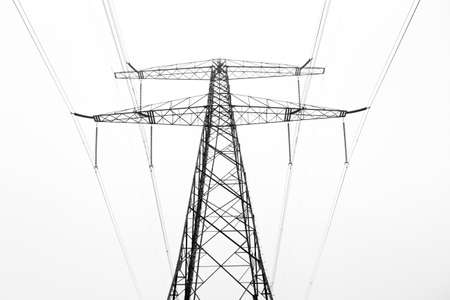 Power pylon from below on a foggy morning in the Netherlandsの写真素材