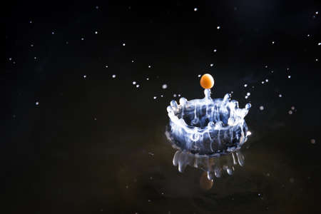 Drops of milk with coffee splashing in water, high speedの写真素材
