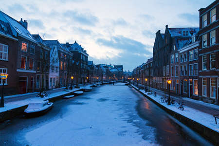 Frozen river Rhine  Oude rijn  at twilight in Leiden in the Netherlandsの写真素材