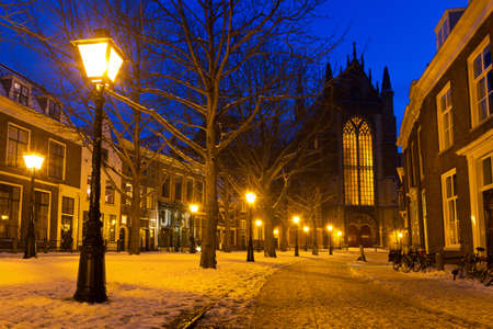 Hooglandsekerkgracht looking at the back of the Hooglandse church in Leiden at twilight in winter with snow in the Netherlandsのeditorial素材