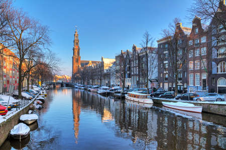 Beautiful early morning winter view on the Westerkerk and the Prinsengracht, one of the  city canals of Amsterdam, The Netherlands  HDR のeditorial素材