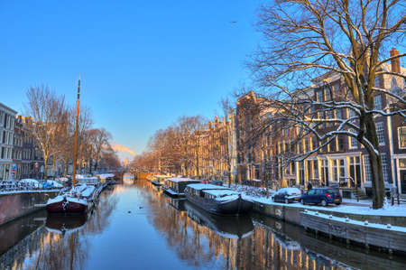 Beautiful early morning winter view on one of the city canals of Amsterdam, The Netherlands  HDR のeditorial素材