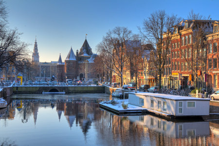 Beautiful early morning winter view on the Nieuwmarkt and the Geldersekade, one of the  city canals of Amsterdam, The Netherlands  HDR のeditorial素材