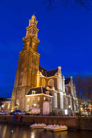 Beautiful view on the Westerkerk church in Amsterdam, the Netherlands, at night in winter  の写真素材