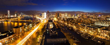 Beautiful aerial view of the skyline of Rotterdam, the Netherlands, at twilightの写真素材