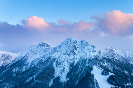 Beautiful sunrise in the Italian alps with the first light on the mountain topsの写真素材