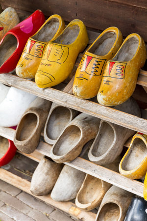 Typical dutch wooden shoes in front of a house farm in the Netherlands