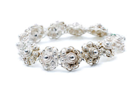 Antique silver bracelet made out of a chain called  zeeuwse knoop , a traditional dutch jewel typeの写真素材